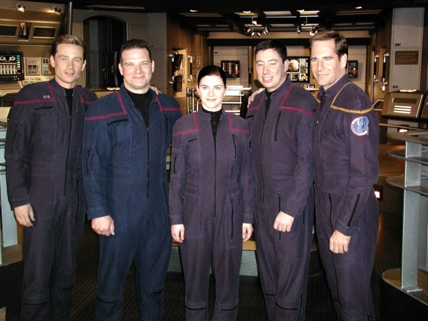 USS Enterprise (CVN 65) Feb. 28, 2002 -- Sailors of the Year for the year 2001 meet castmembers of the latest Star Trek television series entitled Enterprise. Pictured here on the set of the series are (from left) Conner Trinneer, who plays Chief Engineer Charles Trip Tucker, III; Aviation Electronics Technician 1st Class Robert S. Pickering, Sailor of the Year; Personnelman 3rd Class Sarah E. Pizzo, Blue Jacket of the Year; Aviation Electricians Mate 2nd Class Timothy J. Whittington, Junior Sailor of the Year; and Scott Bakula, who plays Capt. Jonathan Archer. The three Sailors were given the opportunity to appear in a scene during an episode which aired recently.